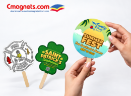 Custom paper hand fans on wooden sticks featuring fire rescue, St. Patrick's celebration, and summer fest designs from Custom Magnets Direct
